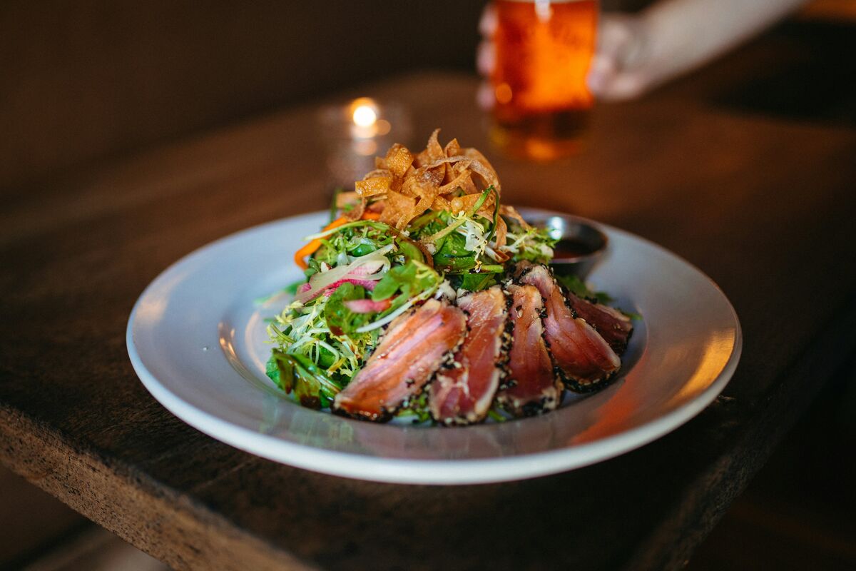 Plate of healthy food demonstrating dining out without derailing progress