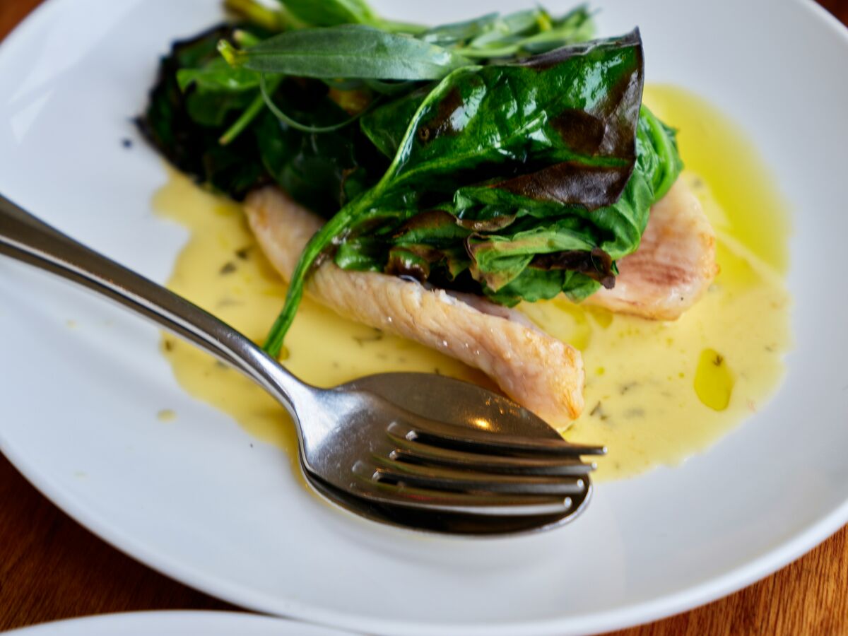 A healthy restaurant fish fillet meal helping you stick to dining out on a diet