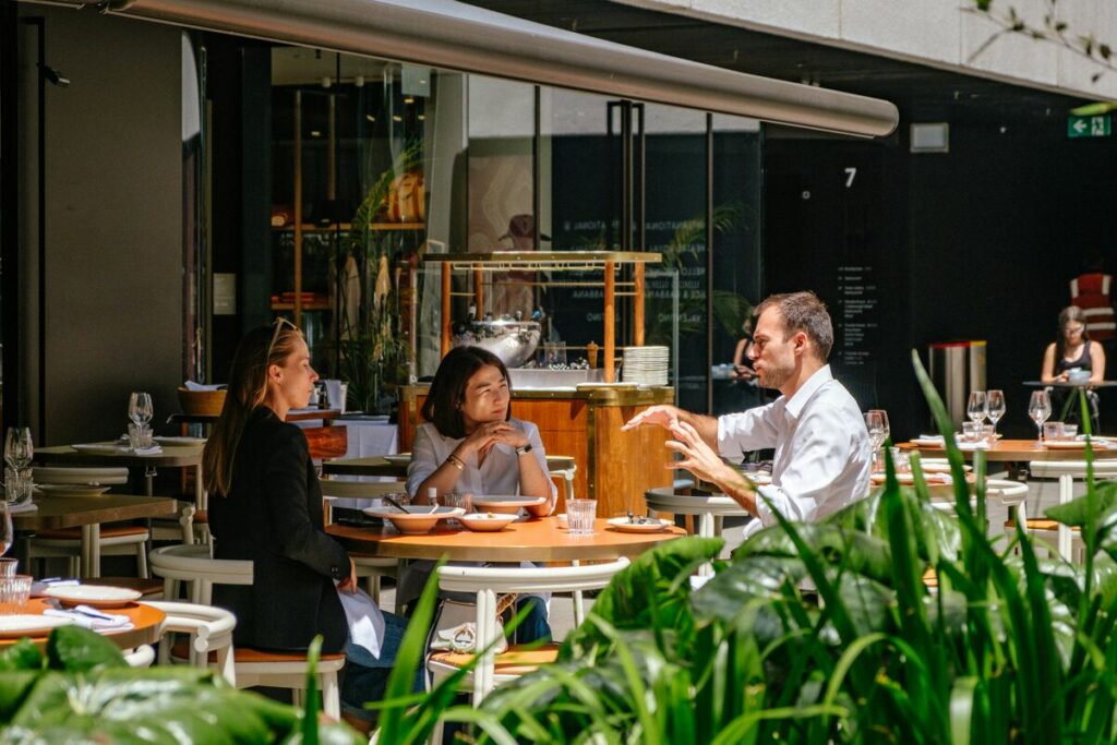 Friends dining out on a diet at an outdoor cafe