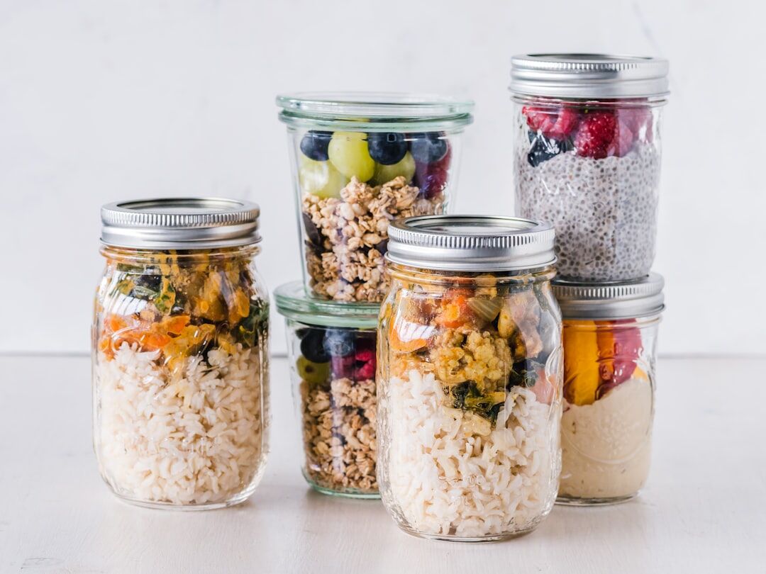 Healthy meal prep containers with breakfast and lunch portions ready for macro tracking