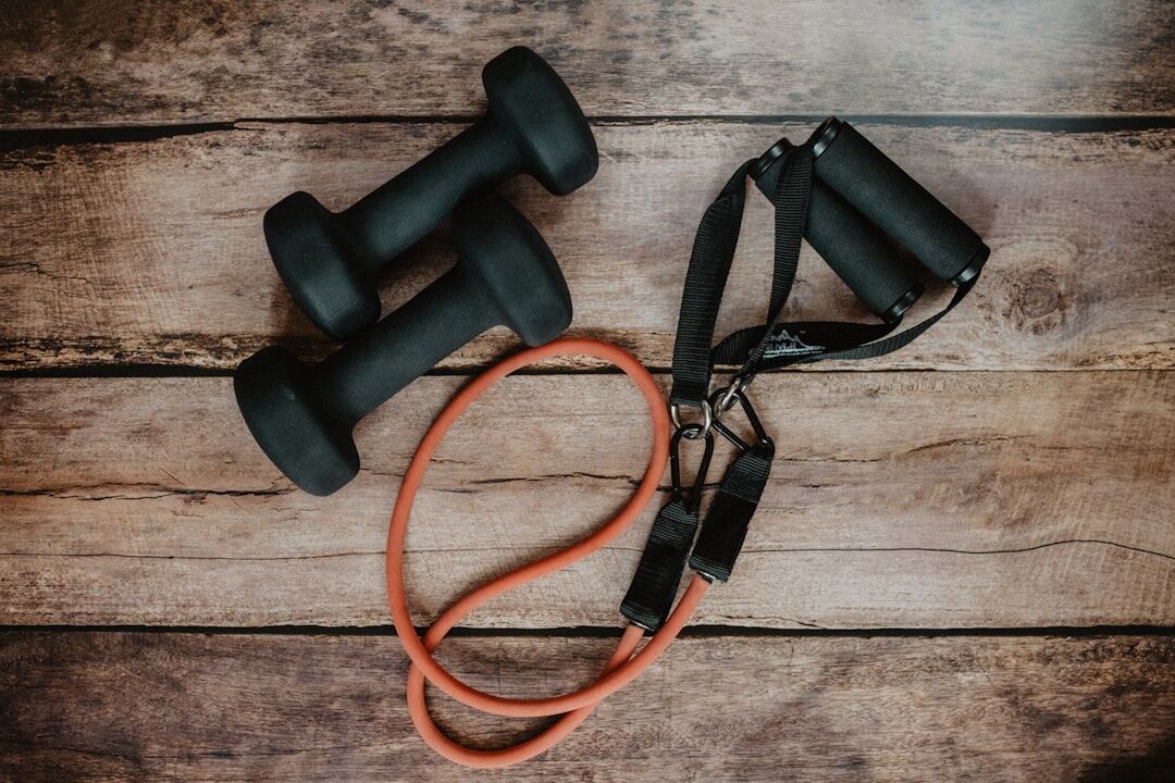 Dumbbells and home workout gear on the floor - toning myths - fitness friday facts