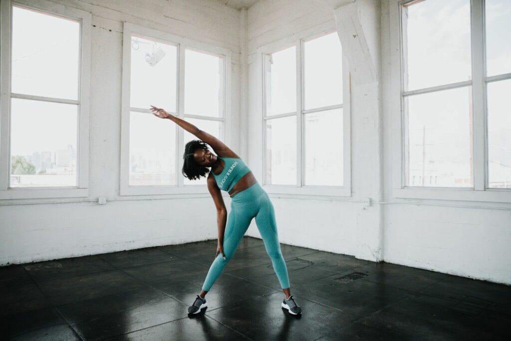 A person performing stretching before workout in the gym - fitness friday facts