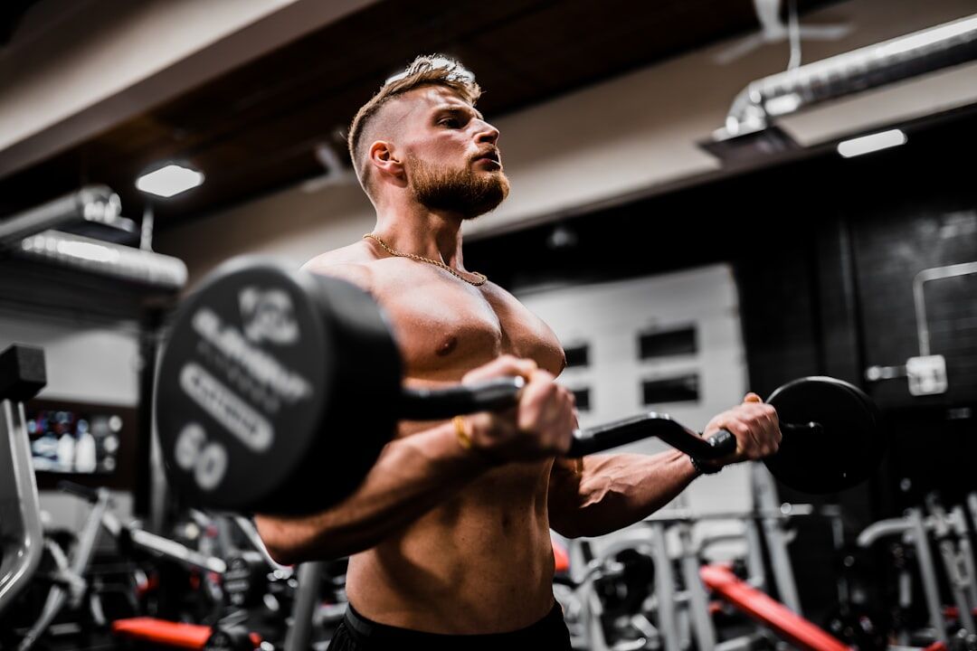 Athlete doing dumbbell curls - pull day workout - workout wednesday