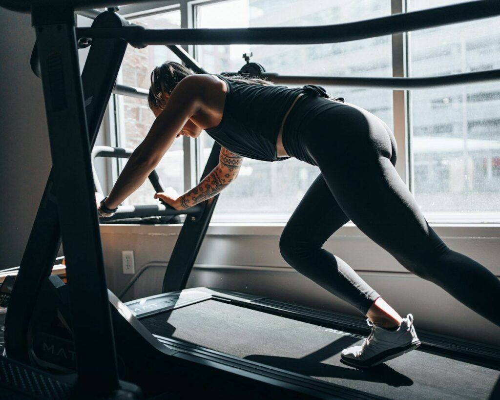 Woman running on treadmill - cardio myths - fitness friday facts