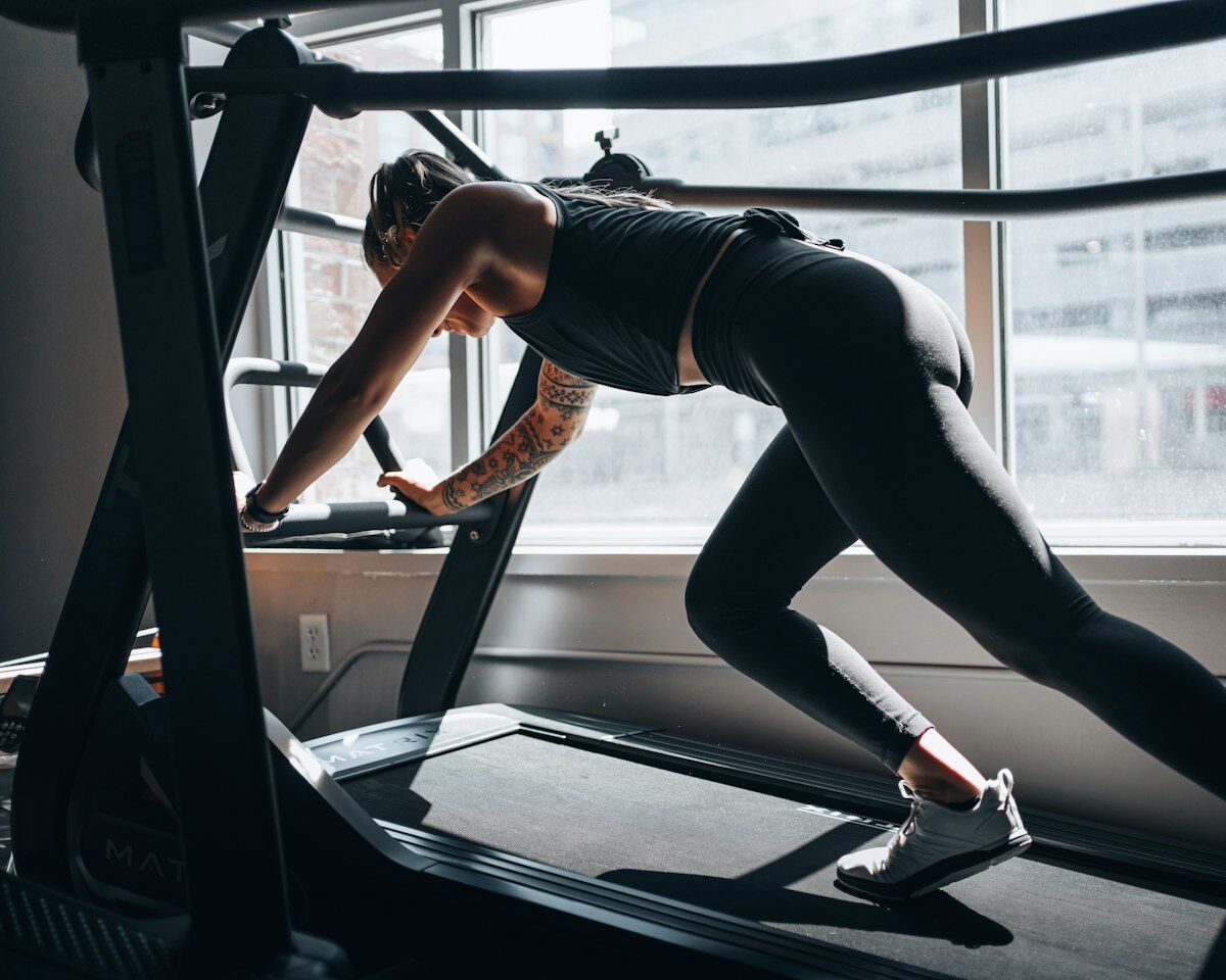 Woman running on treadmill - cardio myths - fitness friday facts