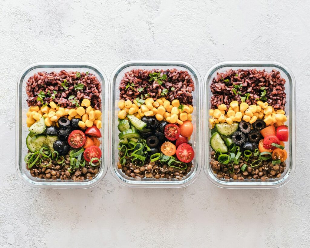Carb cycling meal prep containers with healthy carbohydrates for fat loss